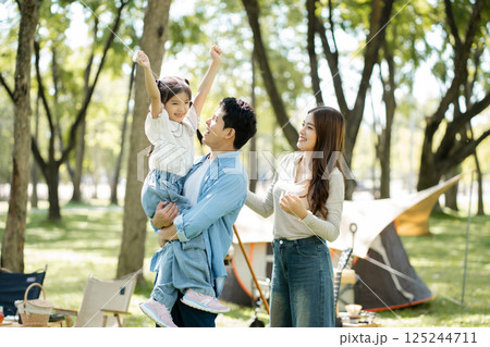 Happy asian family picnic in park, weekend lifestyle outdoors. 125244711