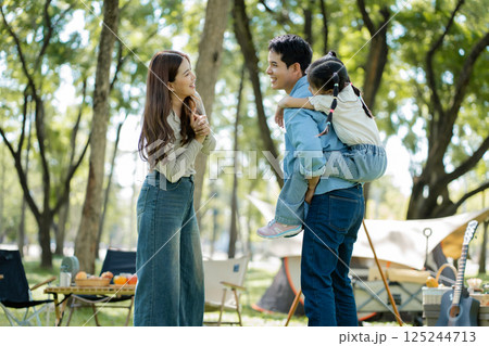 Happy asian family picnic in park, weekend lifestyle outdoors. 125244713