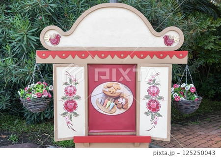 Decorative Display Featuring Cookies With Floral Design and Baskets 125250043