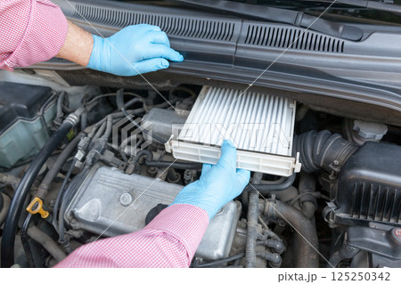 Replacing the cabin pollen air filter for a car Replacing the cabin pollen air filter for a car 125250342