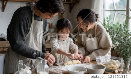 Family Baking Together in Rustic Kitchen 125251515