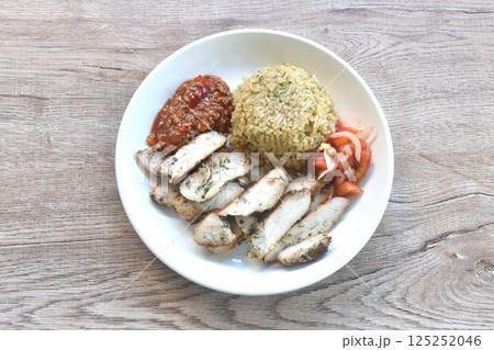 grilled slice chicken black pepper steak dressing tomato sauce with fried rice on plate  125252046