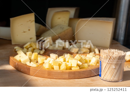 Assorted cheese varieties at a market stall 125252411