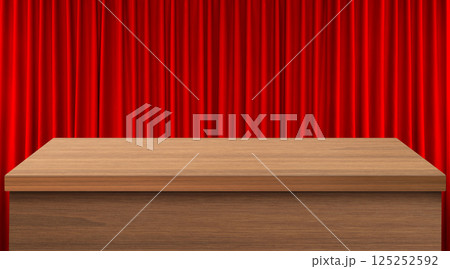 An empty wooden table with a red curtain as a background. An empty wooden table with a red curtain as a background. 125252592