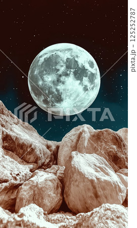 Large glowing moon rising over rocky landscape at night 125252787