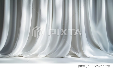 Elegant white silk curtain with smooth waves and soft gray shadows, matte textured backdrop for luxury interior design and minimal product presentation 125255866