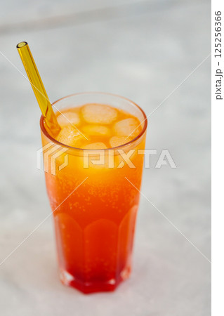 Dirty Soda with Ice Cubes in Tall Glass on Gray Background, Trendy Carbonated Drink Concept Dirty Soda with Ice Cubes in Tall Glass on Gray Background, Trendy Carbonated Drink Concept 125256366