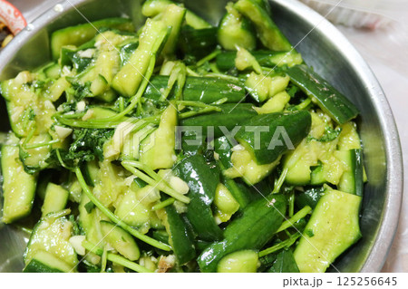 close up of Chinese spicy sour smashed cucumber salad on a plate close up of Chinese spicy sour smashed cucumber salad on a plate 125256645