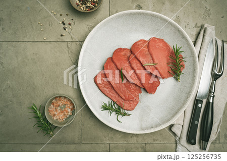 Raw sliced beef or lamb tenderloin meat 125256735