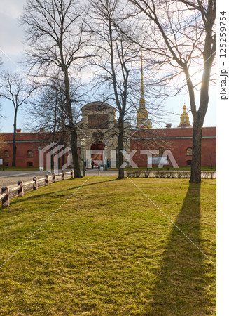 the Peter and Paul Fortress spire at sunset 125259754