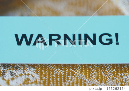 Warning sign displayed prominently on a surface 125262134