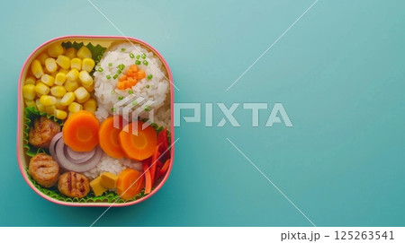 Lunch box rice with carrot, corn, sausage slice for school or work copy space 125263541