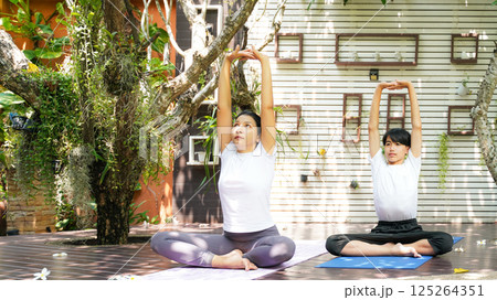 Lifestyle woman and teenage student yoga exercise and pose for healthy life.  125264351