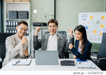 Young Asian business team creative businesspeople coworker, teamwork celebrating achievement and in planning Young Asian business team creative businesspeople coworker, teamwork celebrating achievement and in planning 125265515