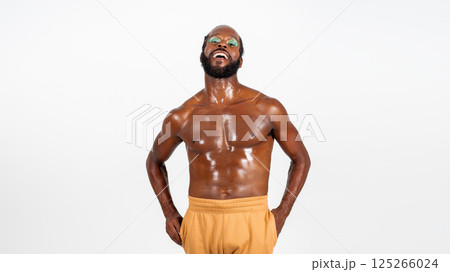 Laughing bearded gay man with bright makeup on 125266024