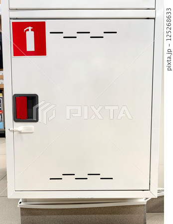 fire safety equipment cabinet located in public building for easy access during emergencies. 125268633