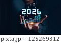 Businessman analyzing 2025 profit growth performance for the 2025-2026 financial plan. Image depicts market concepts, finance trends, revenue graphs, money, and profitability analysis for future 125269312