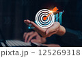 Businessman analyzing 2025 profit growth performance for the 2025-2026 financial plan. Image depicts market concepts, finance trends, revenue graphs, money, and profitability analysis for future 125269318