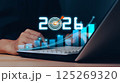 Businessman analyzing 2025 profit growth performance for the 2025-2026 financial plan. Image depicts market concepts, finance trends, revenue graphs, money, and profitability analysis for future 125269320