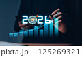 Businessman analyzing 2025 profit growth performance for the 2025-2026 financial plan. Image depicts market concepts, finance trends, revenue graphs, money, and profitability analysis for future 125269321