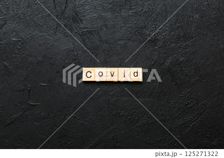 covid word written on wood block. covid text on table, concept 125271322