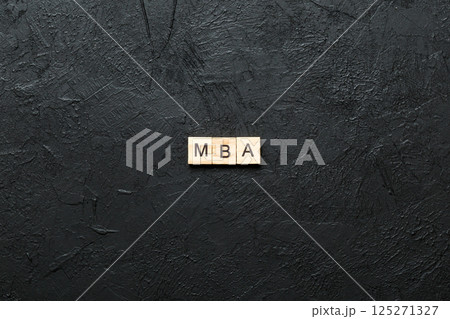 MBA word written on wood block. Master of Business Administration text on table, concept MBA word written on wood block. Master of Business Administration text on table, concept 125271327
