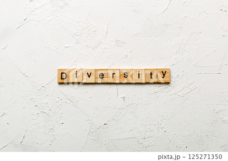 Diversity word written on wood block. Diversity text on cement table for your desing, concept Diversity word written on wood block. Diversity text on cement table for your desing, concept 125271350