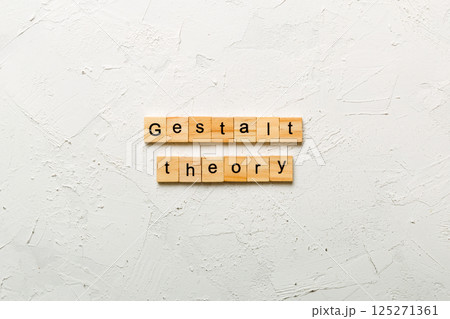 gestalt theory word written on wood block. gestalt theory text on cement table for your desing, concept 125271361