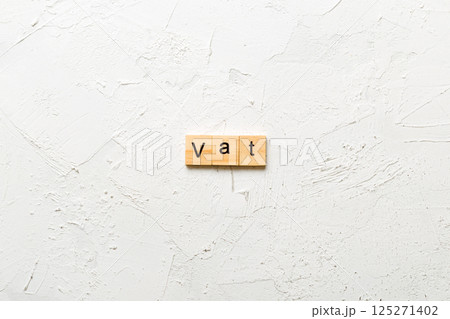 Vat word written on wood block. Vat text on table, concept Vat word written on wood block. Vat text on table, concept 125271402