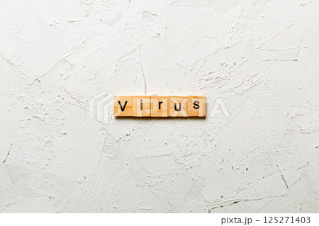 virus word written on wood block. virus text on cement table for your desing, concept virus word written on wood block. virus text on cement table for your desing, concept 125271403