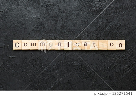 COMMUNICATION word written on wood block. COMMUNICATION text on cement table for your desing, concept 125271541