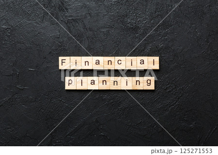 financial planning word written on wood block. financial planning text on cement table for your desing, concept financial planning word written on wood block. financial planning text on cement table for your desing, concept 125271553