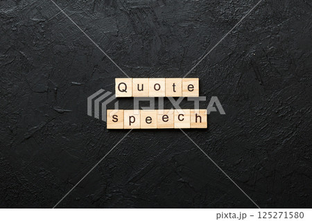 quote speech word written on wood block. quote speech text on cement table for your desing, concept 125271580