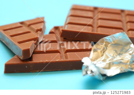 milk chocolate bar on blue background 125271983