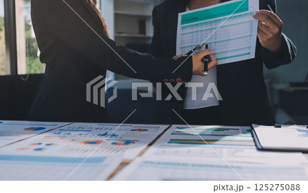 Business analyze,Close up Business people meeting to discuss the situation on the market. Business Financial Concept 125275088