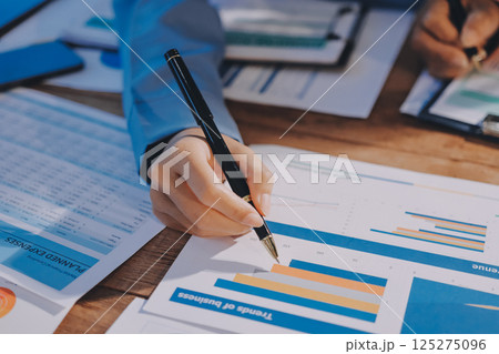 Business analyze,Close up Business people meeting to discuss the situation on the market. Business Financial Concept 125275096