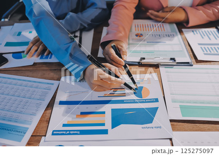 Business analyze,Close up Business people meeting to discuss the situation on the market. Business Financial Concept 125275097