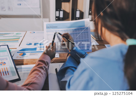 Business analyze,Close up Business people meeting to discuss the situation on the market. Business Financial Concept Business analyze,Close up Business people meeting to discuss the situation on the market. Business Financial Concept 125275104