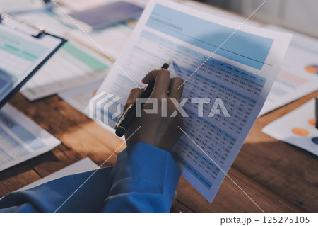Business analyze,Close up Business people meeting to discuss the situation on the market. Business Financial Concept 125275105