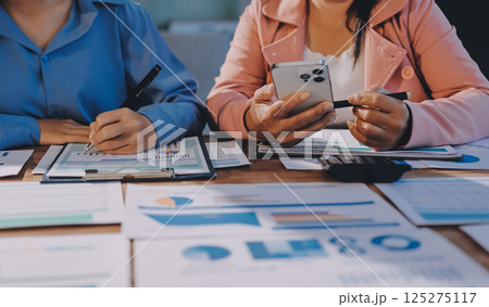 Business analyze,Close up Business people meeting to discuss the situation on the market. Business Financial Concept 125275117