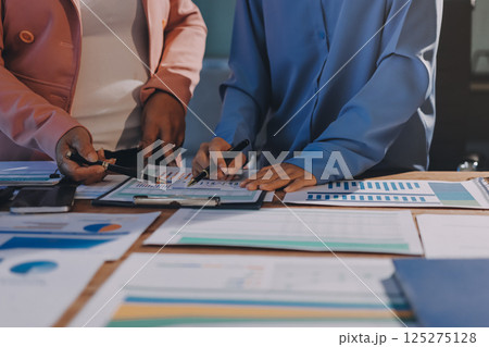 Business analyze,Close up Business people meeting to discuss the situation on the market. Business Financial Concept 125275128