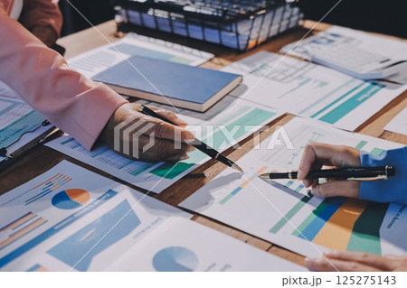 Business analyze,Close up Business people meeting to discuss the situation on the market. Business Financial Concept 125275143