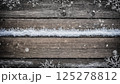 wooden background and snow for new year celebrations or Christmas decorations 125278812