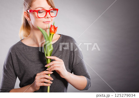 Charming woman smelling flower feel peace. 125279034