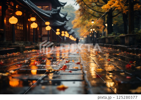 old town on a late rainy evening, wet pavement, street lights, old architecture in Japanese or Chinese style 125280377