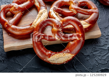 Pretzel or Bretzel, traditional German beer snack, a wheat bread with salt Pretzel or Bretzel, traditional German beer snack, a wheat bread with salt 125280929