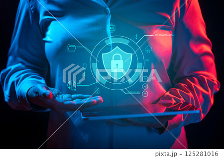 Businessperson holding tablet while showing security icon. Technology innovation on a virtual screen. Concept of Cybersecurity, data protection, digital information privacy, and virus defence 125281016
