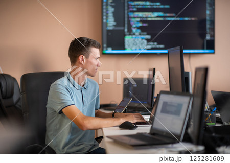 Innovating the Future: A Young Programmer Testing New Smartphone Apps in the Office. Innovating the Future: A Young Programmer Testing New Smartphone Apps in the Office. 125281609