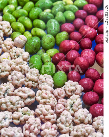 Colorful assortment of snacks displayed for a festive gathering at a local market in the afternoon Colorful assortment of snacks displayed for a festive gathering at a local market in the afternoon 125282326
