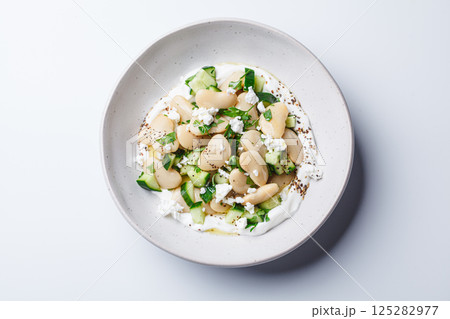 Butter bean salad with yogurt, cucumber and feta. Butter bean salad with yogurt, cucumber and feta. 125282977